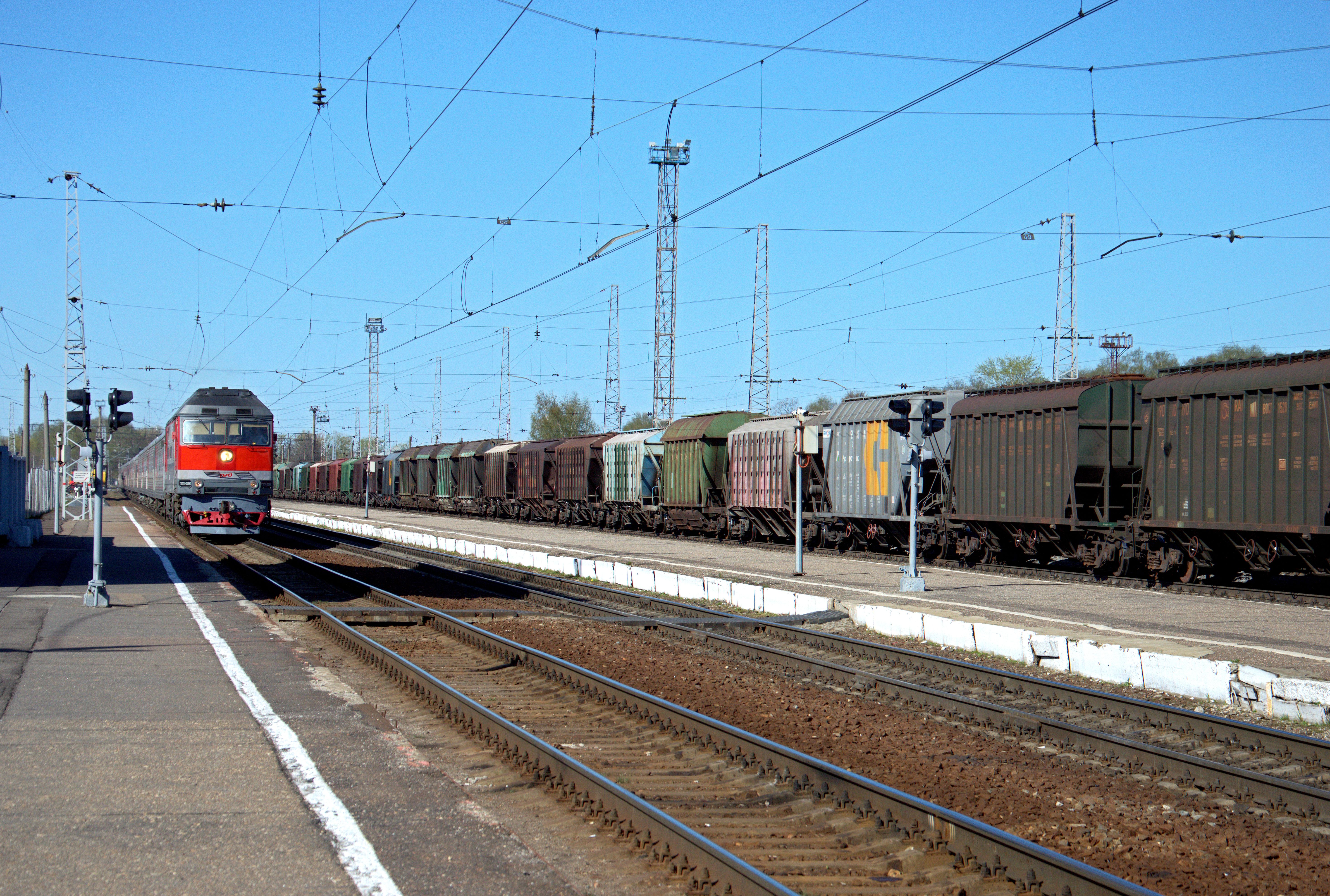Freight train and cargo wagons at a railway station