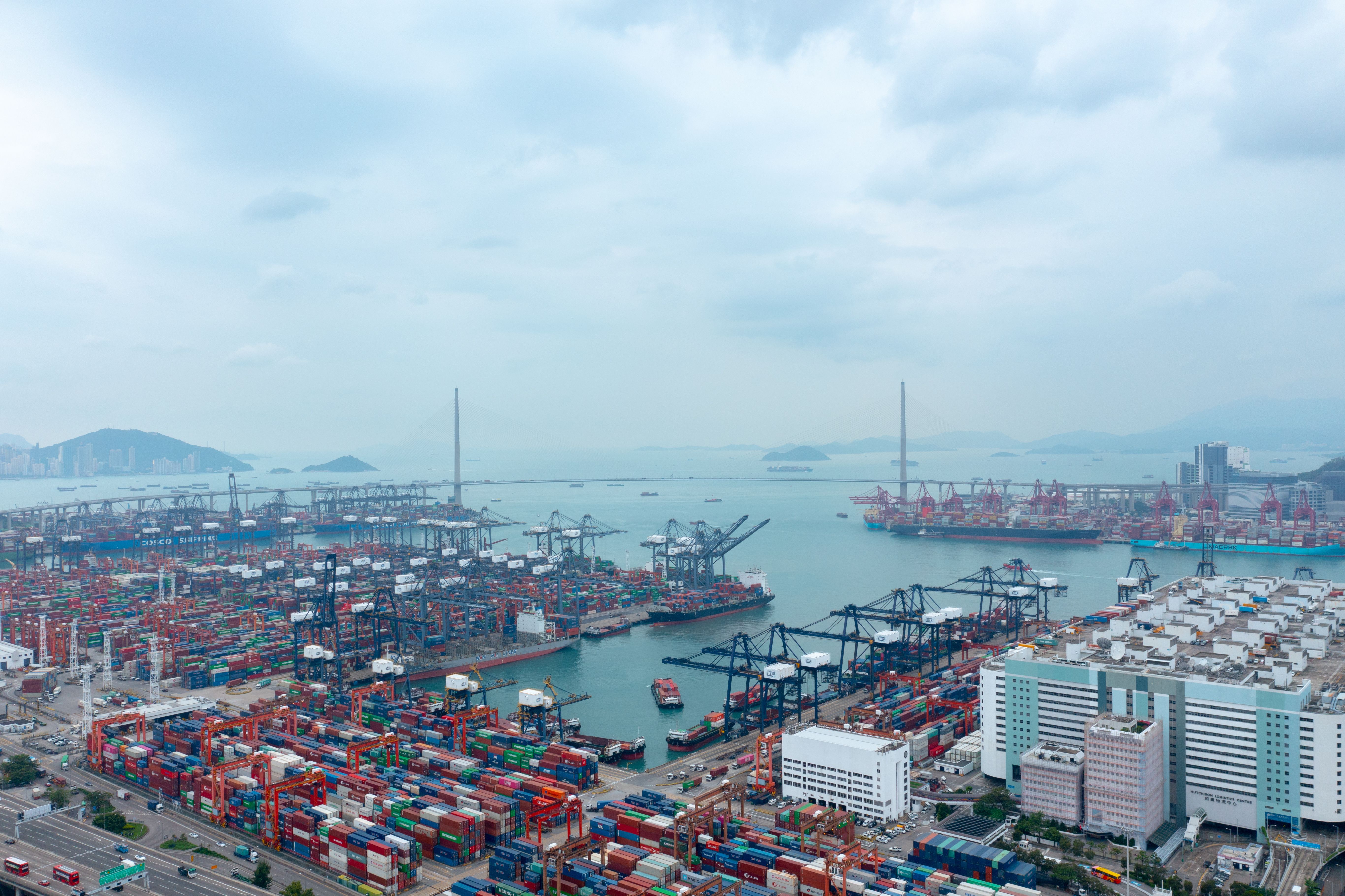 Aerial view of a container port and surrounding logistics infrastructure
